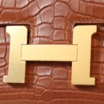 HERMèS Matte Alligator Constance Mini 19 shoulder bag in Gold with Gold hardware